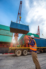the loading and discharging opertion container ship vessel in port takes control by stevedore and foreman in charge, working in port terminal being for logistics and transport services to worldwide