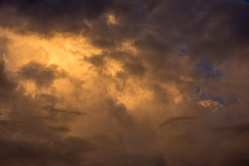 Golden clouds in the sky at sunset