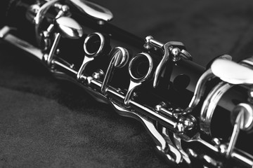 Obraz premium A clarinet on top of a black cloth