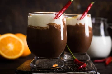 Gardinen Chilischoten Warming spicy hot chocolate with orange and chili  © ekatherina