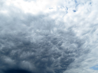 Dark dramatic sky with a stormy gray clouds just before storm. The rain is coming soon, autumn gloomy sky