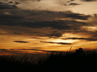 Take a photo at sunset.The sky is orange.Most of the sky is orange, but there are other colors.