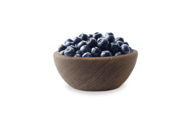 Bilberres in a bowl isolated on white. Ripe blaeberries with copy space for text. Blueberries basil on a white background.