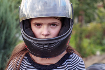 beautiful girl in a motorcycle helmet