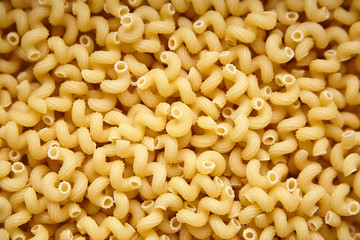 Heap of Uncooked Cavatappi Italian Pasta .Top view. Food Background