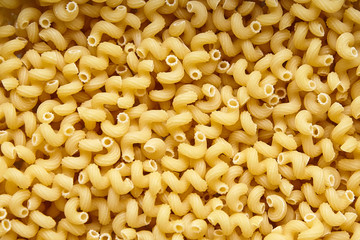 Heap of Dry Uncooked Cavatappi Italian Pasta . Food Background
