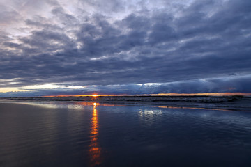 Colorful the sea sunset with  orange-violet paints