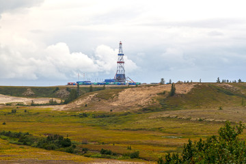 Fototapeta na wymiar Oil and gas drilling rigt with landscape of forest-tundra,