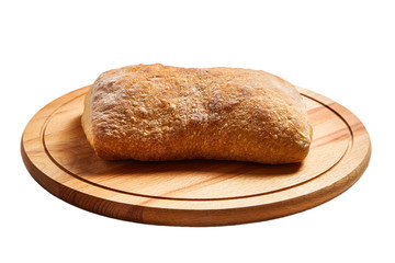 traditional italian wheat bread ciabatta  on a wooden beech cutting board.   isolated on white background