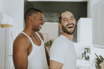 Gay couple hugging in the kitchen