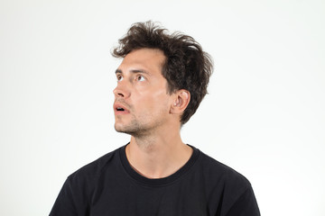 Obraz premium Handsome boy looking right up and opening his mouse