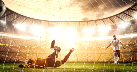 Intense soccer moment in front of the goal on the professional soccer stadium.