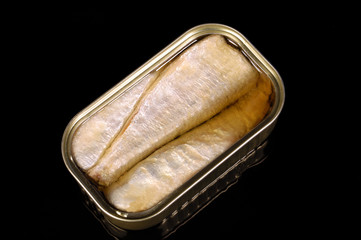 tin sardines isolated on black
