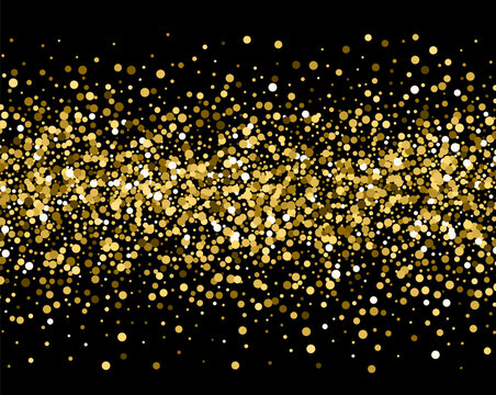 Gold sparkles on black background. Gold glitter .