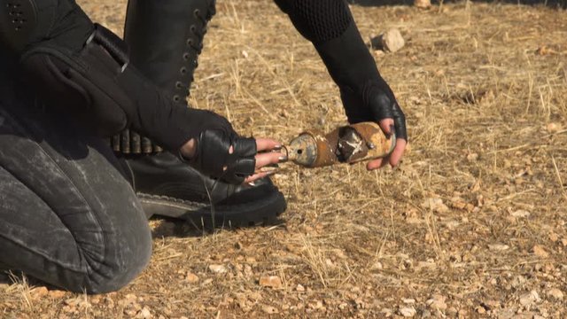 Exploded Artillery Mortar shell mine found by sapper biker woman Demining (Bomb disposal) mortar bomb.