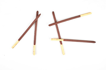 Biscuit sticks in chocolate coating on white background. Chocolate, cookies, biscuits coated bar.