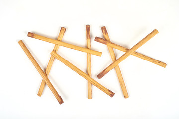 biscuit sticks with sweet filling on white background.