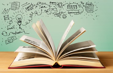 Open book with  drawing on background