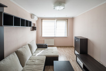 Interior of the flat. Warm tones, wooden floor. 