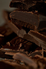 close-up view of gourmet yummy chocolate pieces, chocolate background