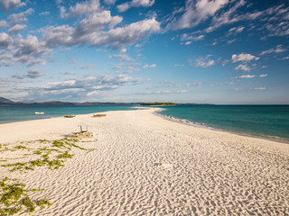 Aerial view of a magnificent landscape: an island with white beach, crystal clear sea, palm trees. Wonderful places for a dream vacation. Concept of: holiday, wild, nature.