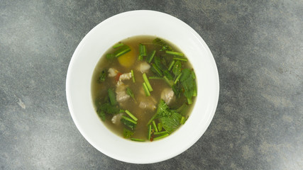 Thai food. Pork spare rib Spicy soup on stone background. Top view, Copy space for design. .