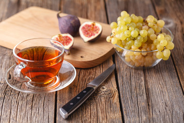 morning cup of tea with fruit, healthy breakfast
