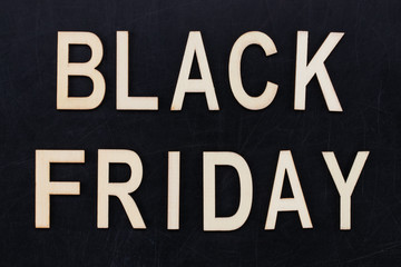 black Friday - text in wooden letters on blackBoard. Copy space