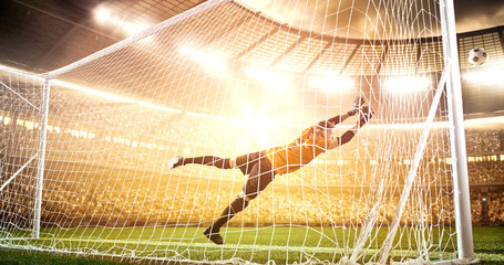 Intense soccer moment in front of the goal on the professional soccer stadium.