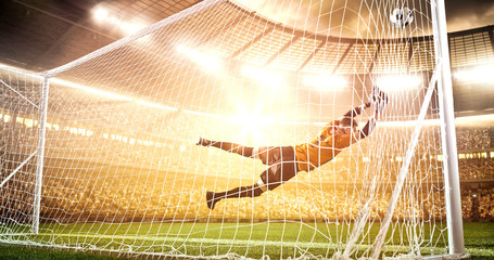 Intense soccer moment in front of the goal on the professional soccer stadium.