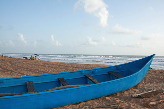 Small fishing canoe on candolim beach, Goa.