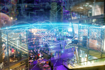 Aerial shot of a large metropolitan city where you can see graphics that connect all the people of the world thanks to the internet. Concept of: speed, future, connection.