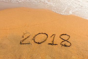 abstract  2018  on a beach sand