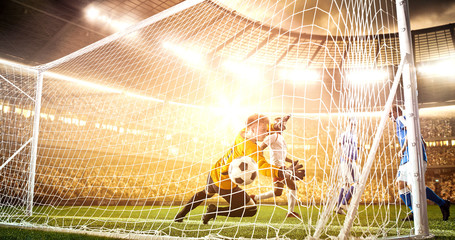 Intense soccer moment in front of the goal on the professional soccer stadium.
