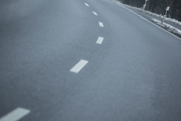 An empty traffic route in winter, special perspective