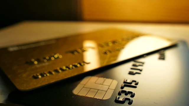 Money in bank accounts. Credit bank cards are on the table. Cashless payments.