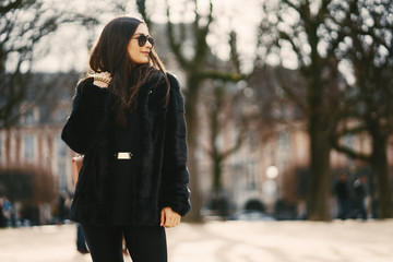 girl walking aroung the streets and the city of Paris