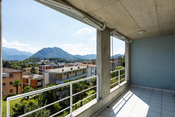 Fototapeta na wymiar Terrace with view on Swiss hills. Nobody inside