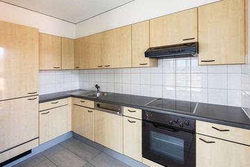 Wooden kitchen and tile in the apartment