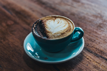 cup of coffee on wooden table