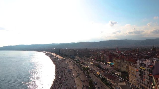 Crowded beach, Old Town, and Promenade des Anglais in Nice, southern France, seen from above (bird's eye) Scene of the 2016 terrorist attack. Establishing shot.