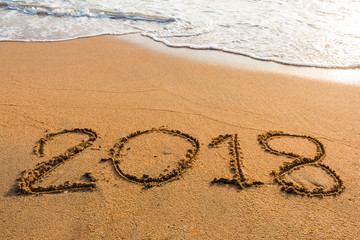 Fototapeta premium abstract 2018 on a beach sand