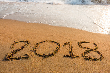 Fototapeta premium abstract 2018 on a beach sand