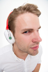 Spy concept. Man listening headphones suspiciously as spy. Guy with earphones listens sound. Man...