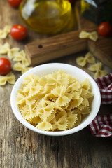 Dry pasta in the white bowl