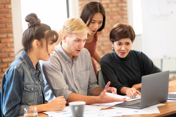 Fototapeta premium Colleagues excited about the earnings they make.