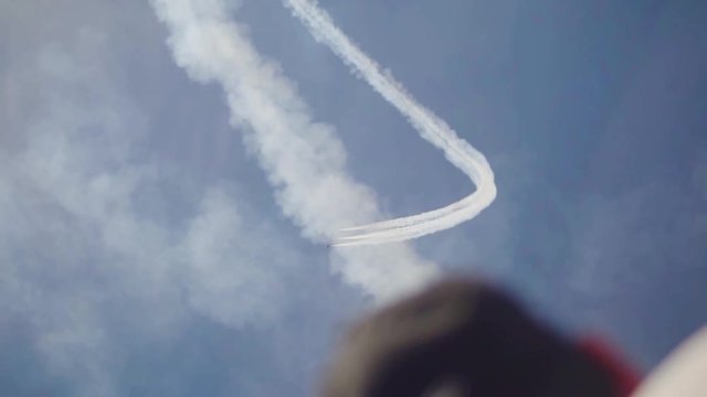 Man Looks Up at Stunt Jets in Slow-Motion