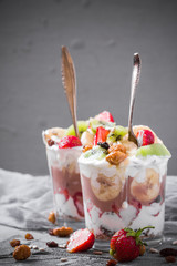 Yoghurt fruit dessert strawberries banana kiwi raisins sunflower seeds oatmeal walnuts caramel