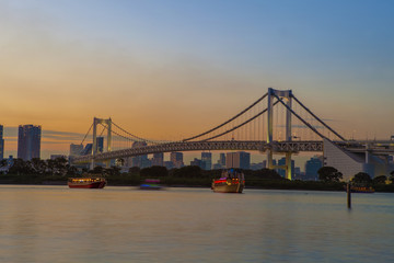 Fototapeta na wymiar beautiful scenic twilight time of rainbow bridge odaiba harbor tokyo japan