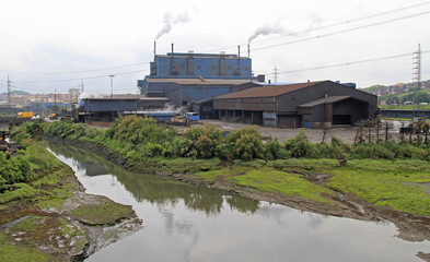 smoking factory in outskirt of Santander city